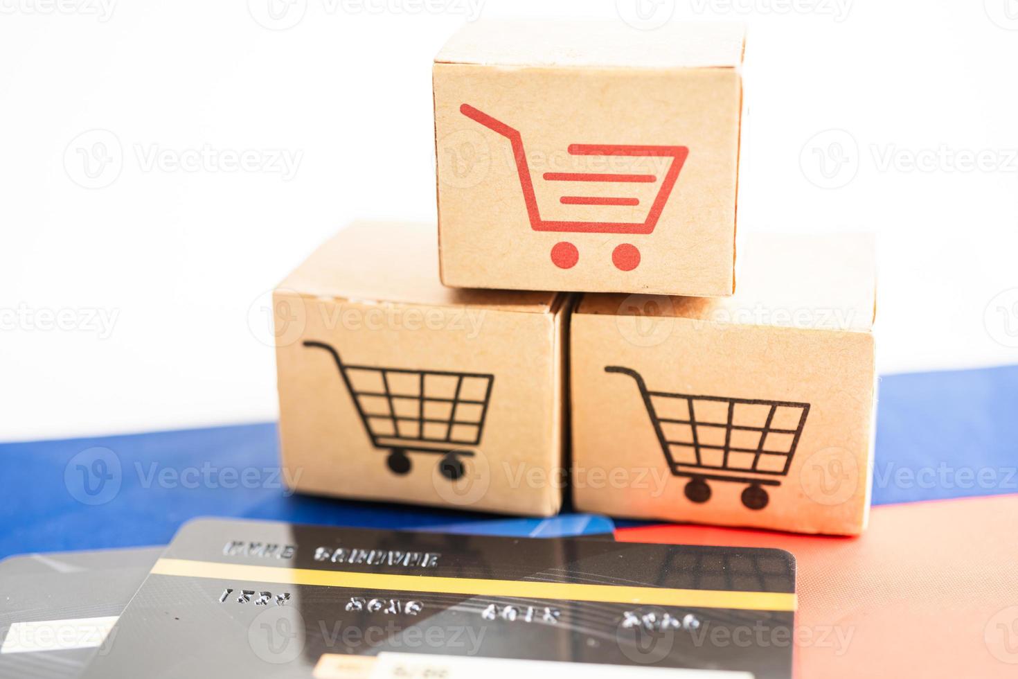 Box with shopping online cart logo and Russia flag, Import Export Shopping online or commerce finance delivery service store product shipping, trade, supplier concept. photo