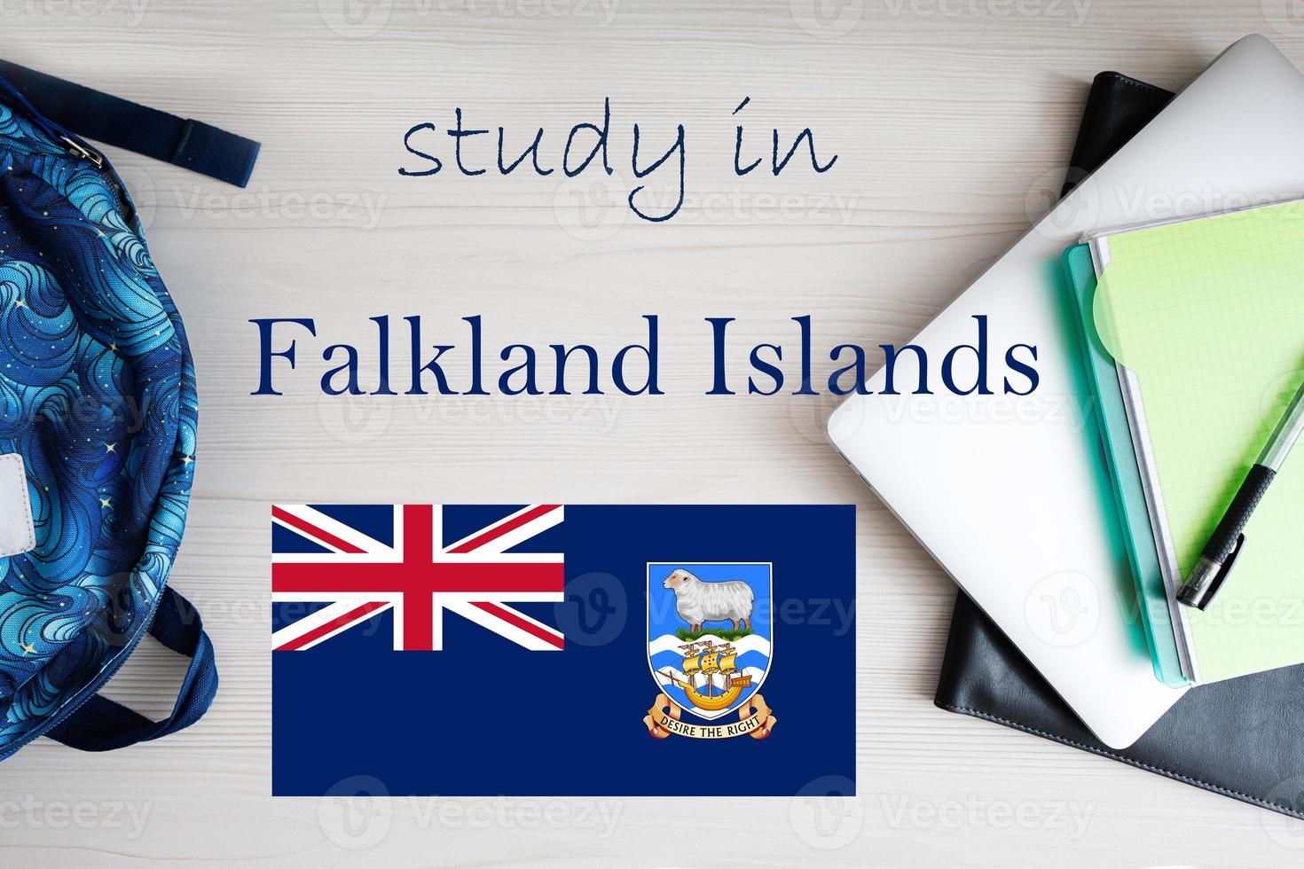 Study in Falkland Islands. Background with notepad, laptop and backpack. Education concept. photo