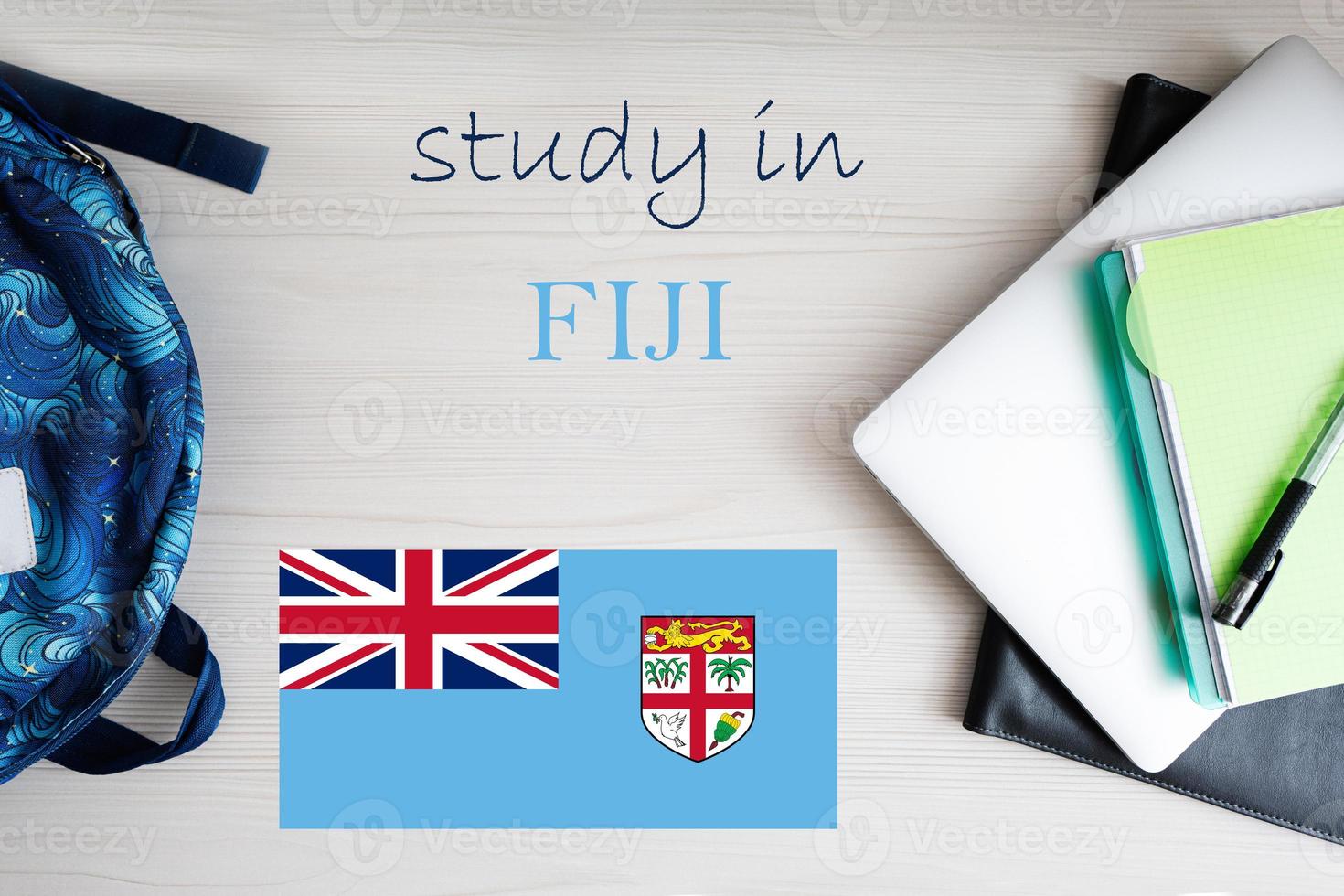 Study in Fiji. Background with notepad, laptop and backpack. Education concept. photo