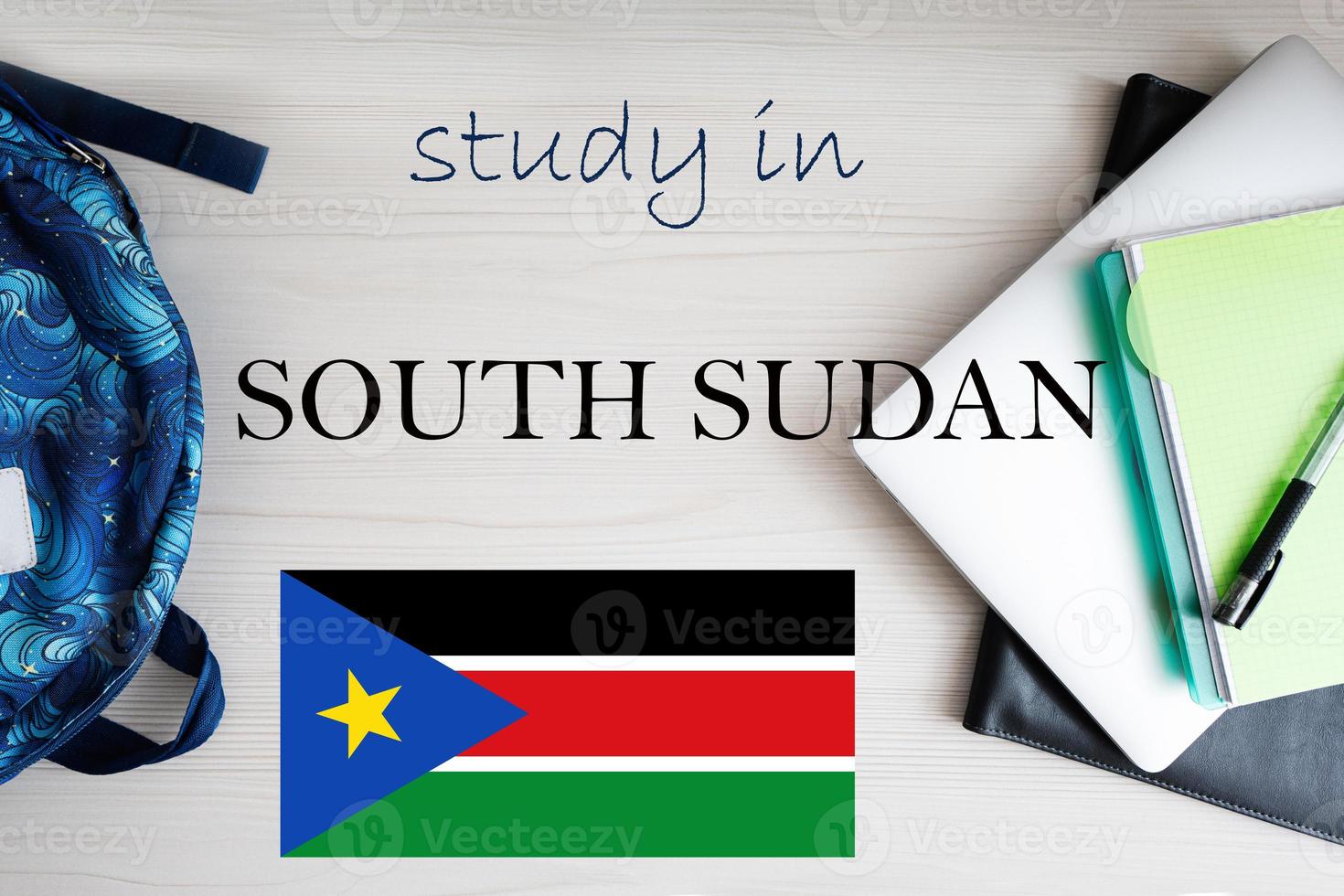 Study in South Sudan. Background with notepad, laptop and backpack. Education concept. photo