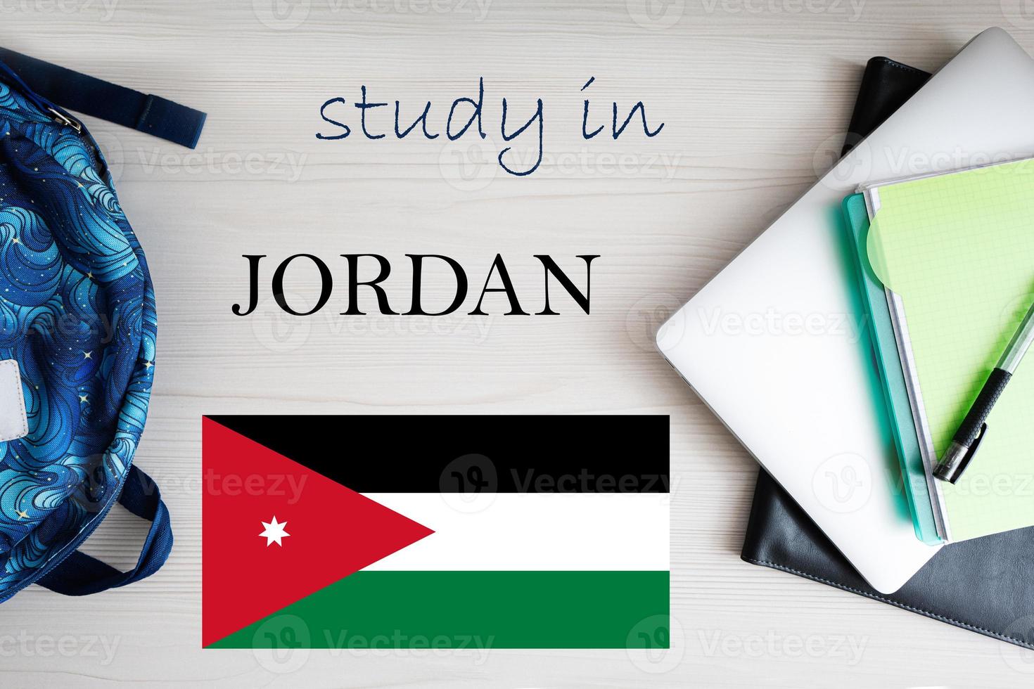 Study in Jordan. Background with notepad, laptop and backpack. Education concept. photo