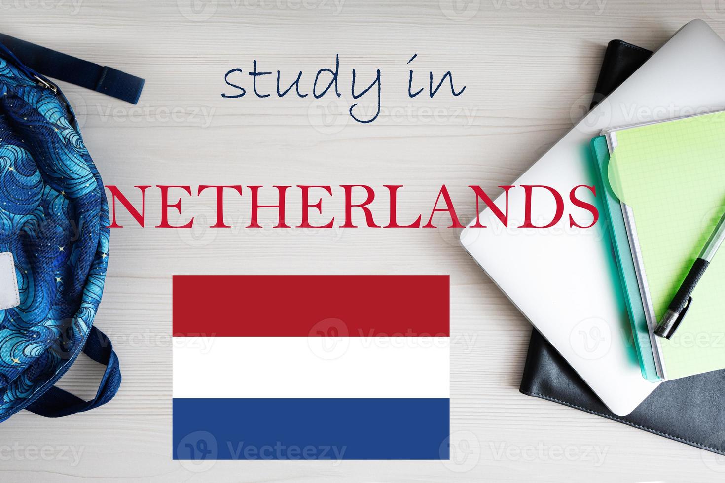 Study in Netherlands. Background with notepad, laptop and backpack. Education concept. photo