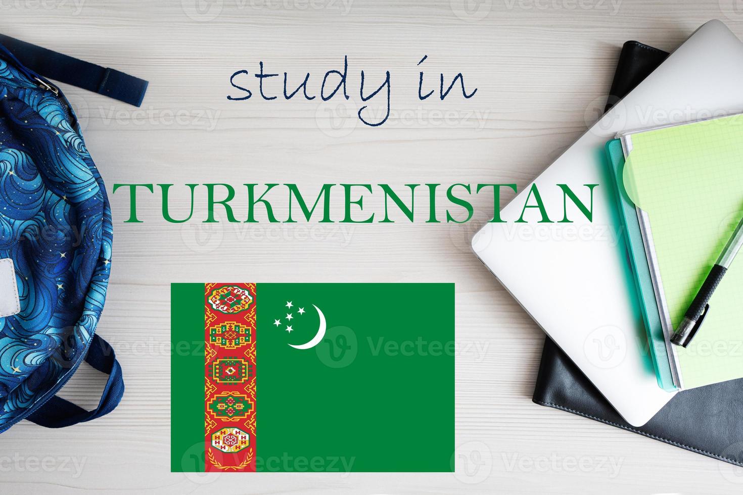 Study in Turkmenistan. Background with notepad, laptop and backpack. Education concept. photo