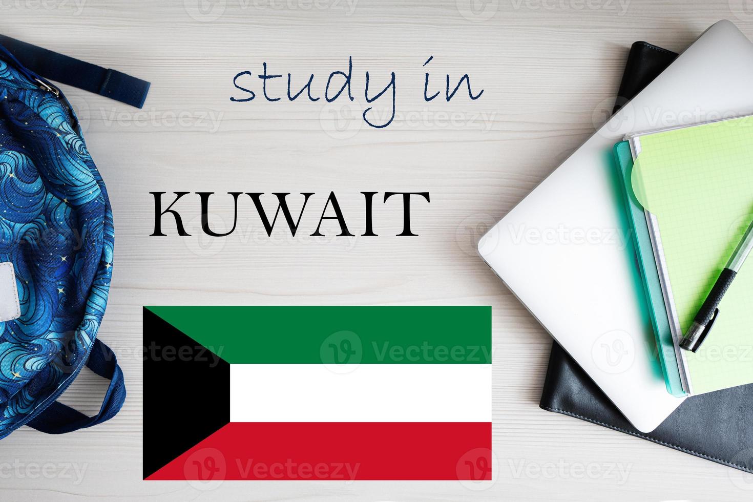 Study in Kuwait. Background with notepad, laptop and backpack. Education concept. photo