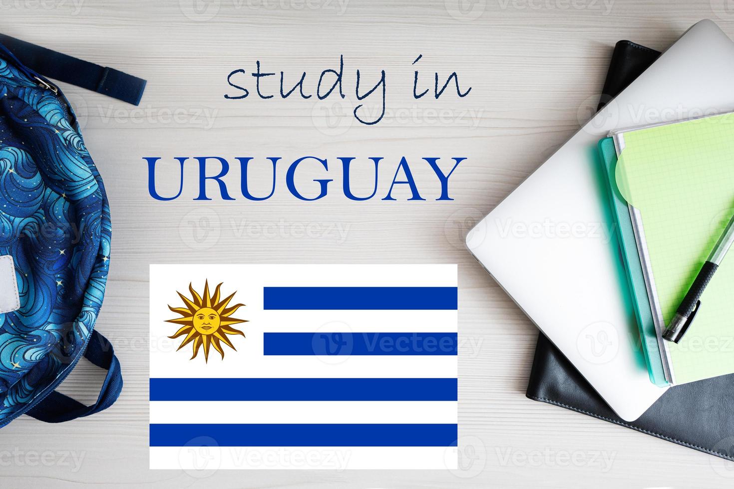 Study in Uruguay. Background with notepad, laptop and backpack. Education concept. photo