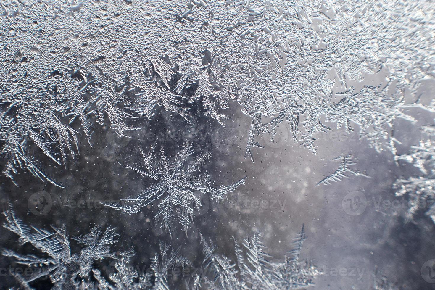 snow pattern on the glass from frost photo