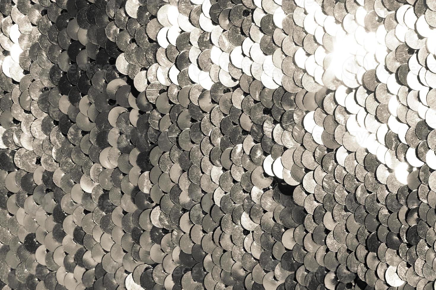 background of silver sequins. shiny sparkling background photo
