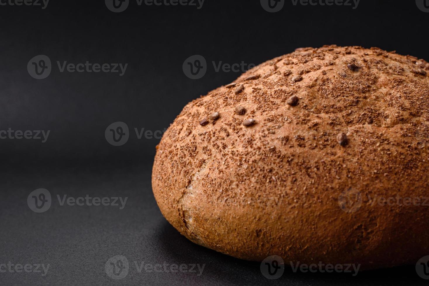 Fresh crispy brown bread with sesame seeds and spices photo