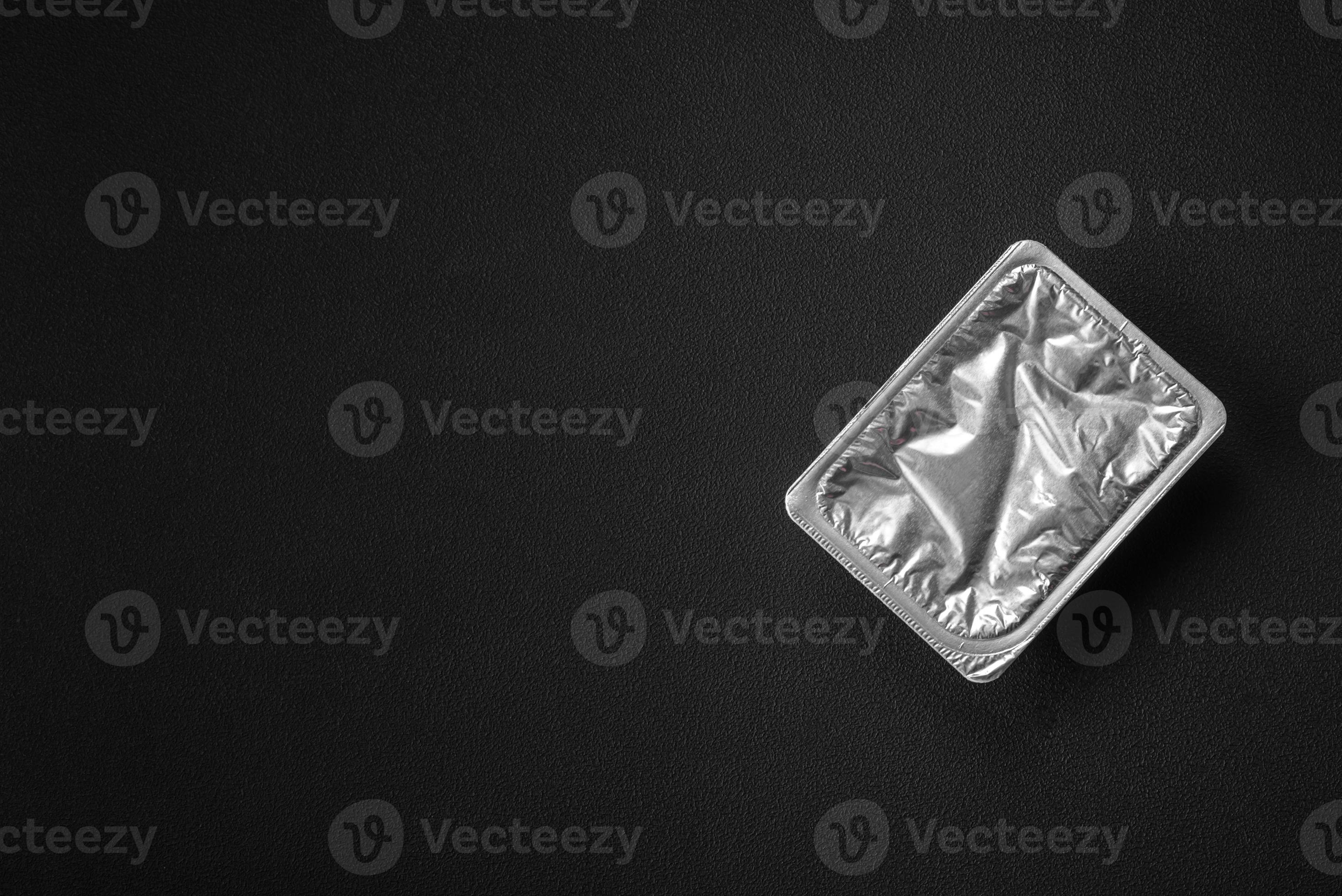 Rectangular plastic box with yogurt or cheese hermetically sealed with