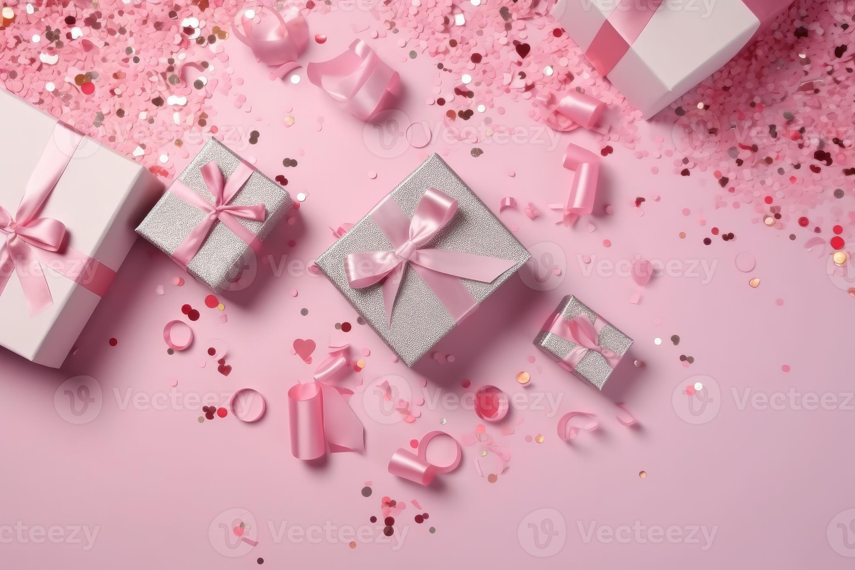 Top view photo of pink gift boxes with pink bow on isolated pastel pink
