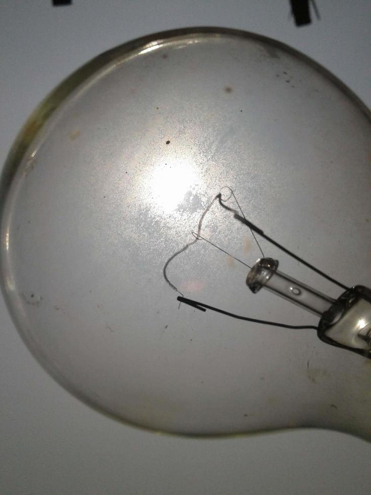 Sunlight can be seen through the glass lamp photo