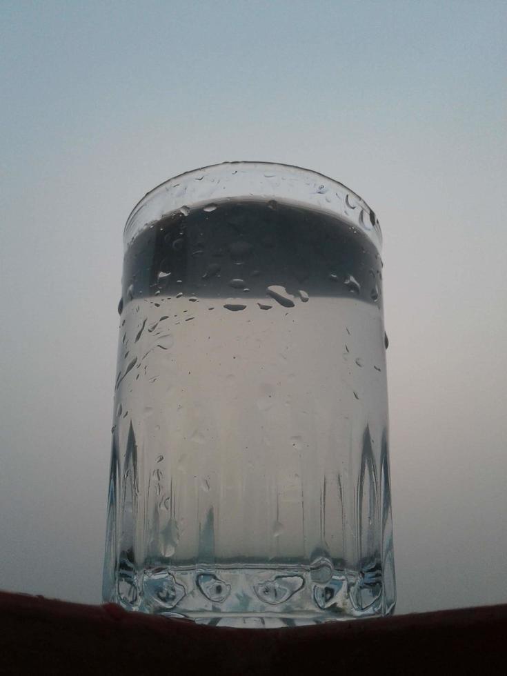 Glass of clear cold water isfull photo