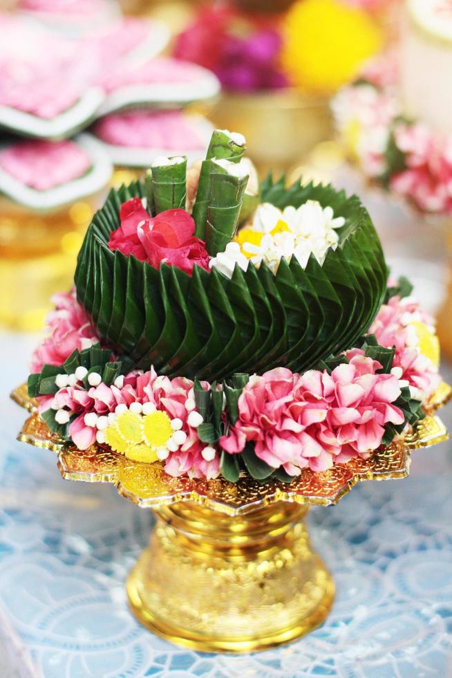 Beautiful flowers decoration on Engagement gold bowl for Thai engagement ceremony.Thai wedding culture tradition photo