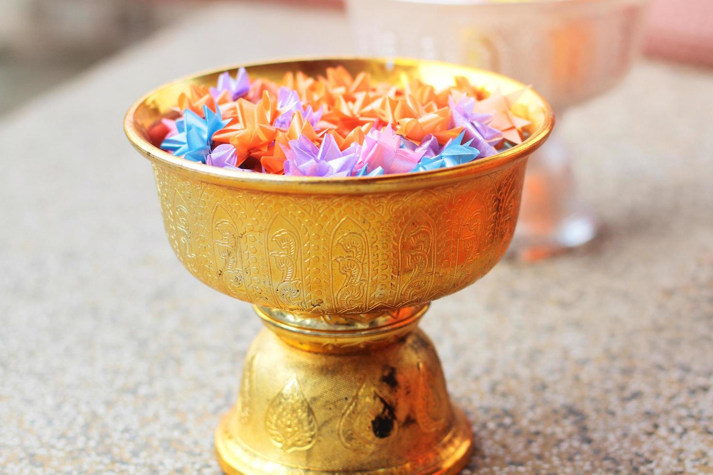 Colorful of Ribbon flowers on gold Tray for Ordination ceremony in buddhist Thai monk. photo