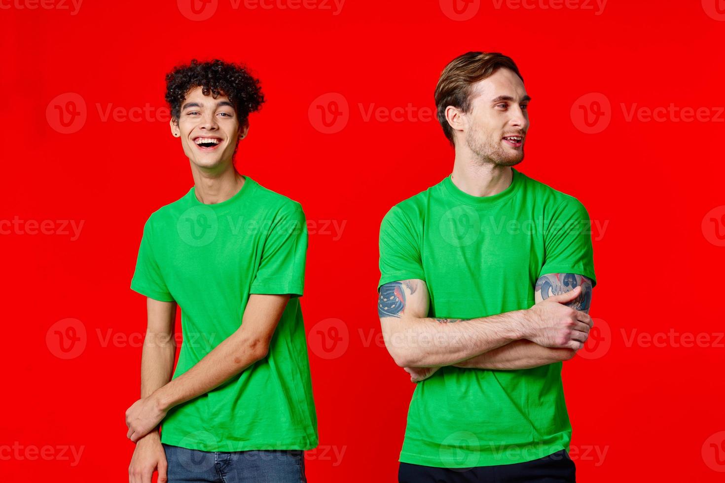 Cheerful friends stand next to communication emotions red background photo