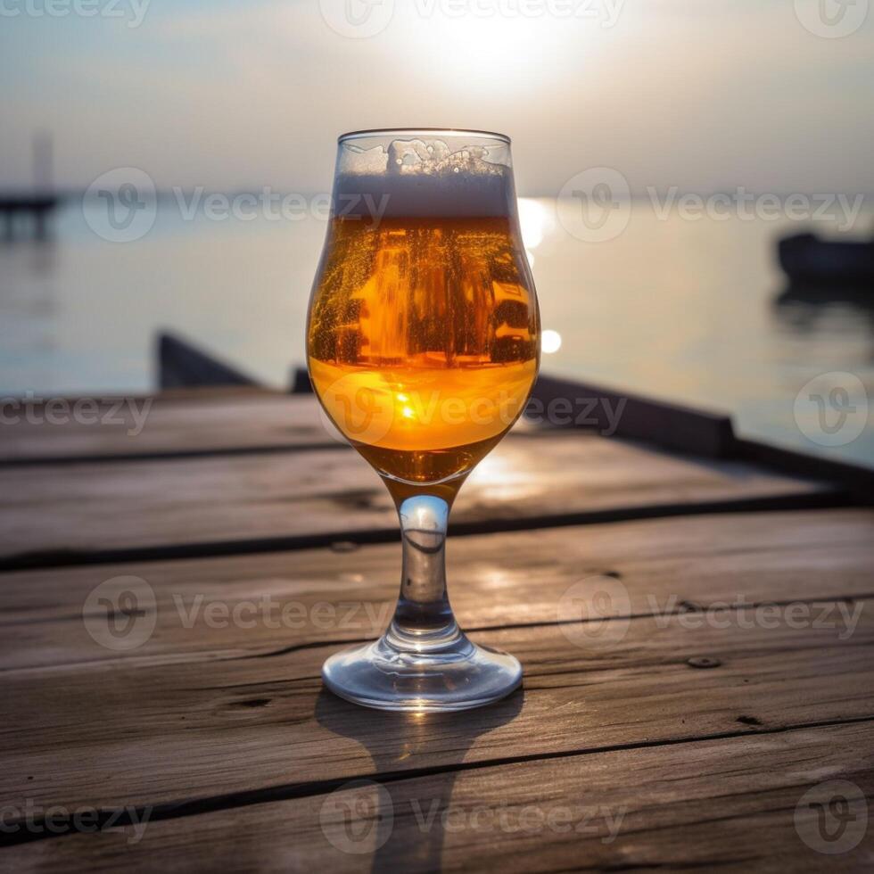 A beer glass on a wooden table photo