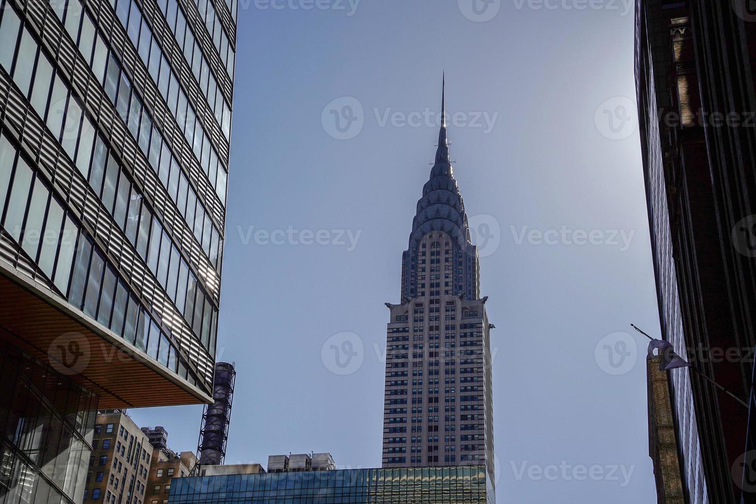 new york manhattan skyscrapers view from the street to the top of the building on sunny clear day photo