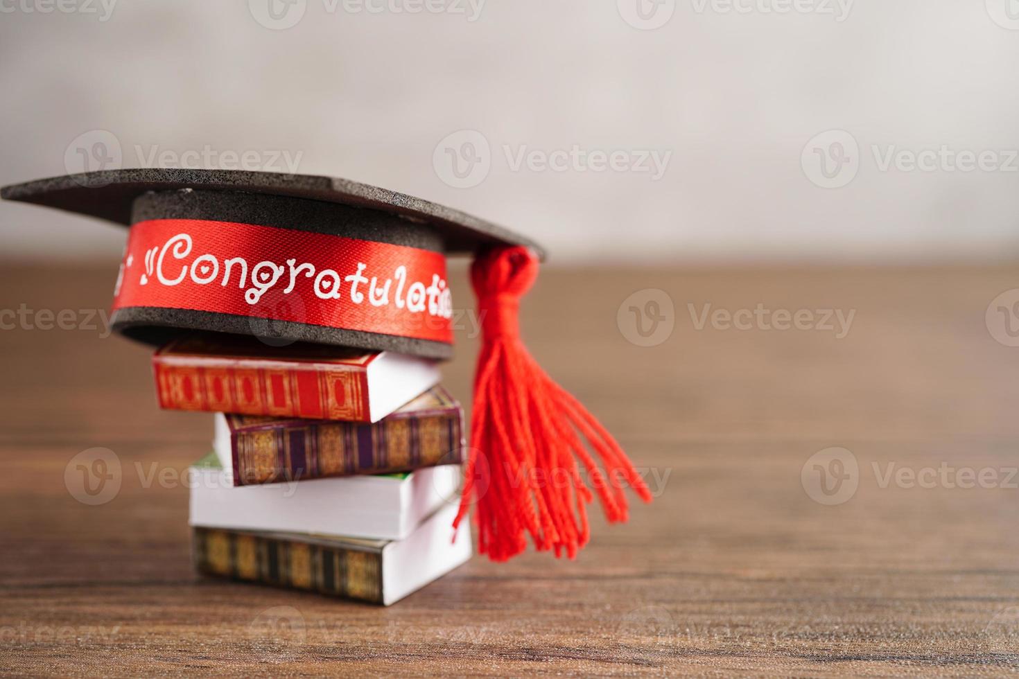 Graduation hat on book with copy space, learning university education concept. photo