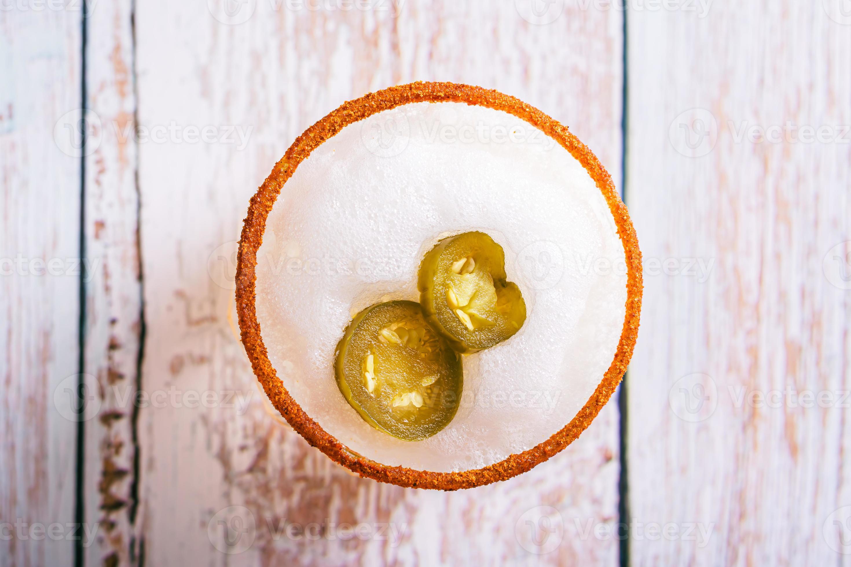 Close up of spicy cocktail with margarita, egg foam, tagine and