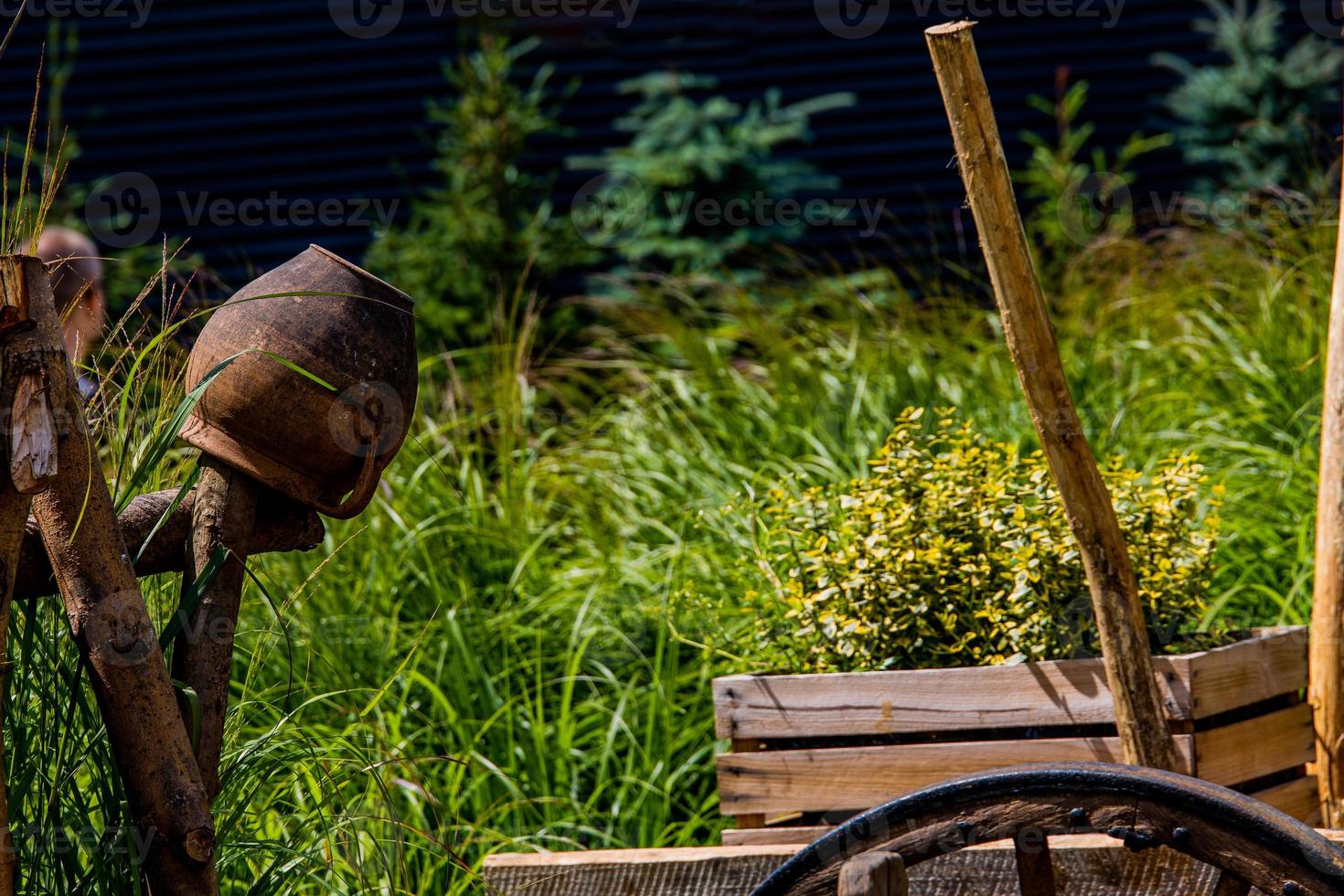 clay pots on the fence decoration Polish village open-air museum on a summer day photo