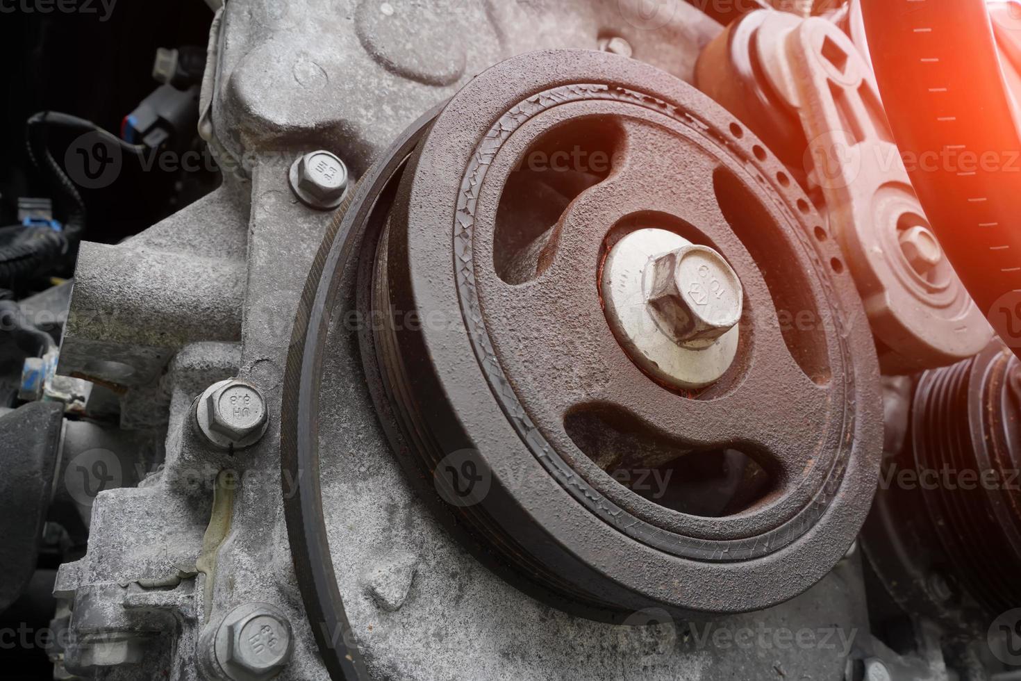 car engine close-up, crankshaft pulley photo