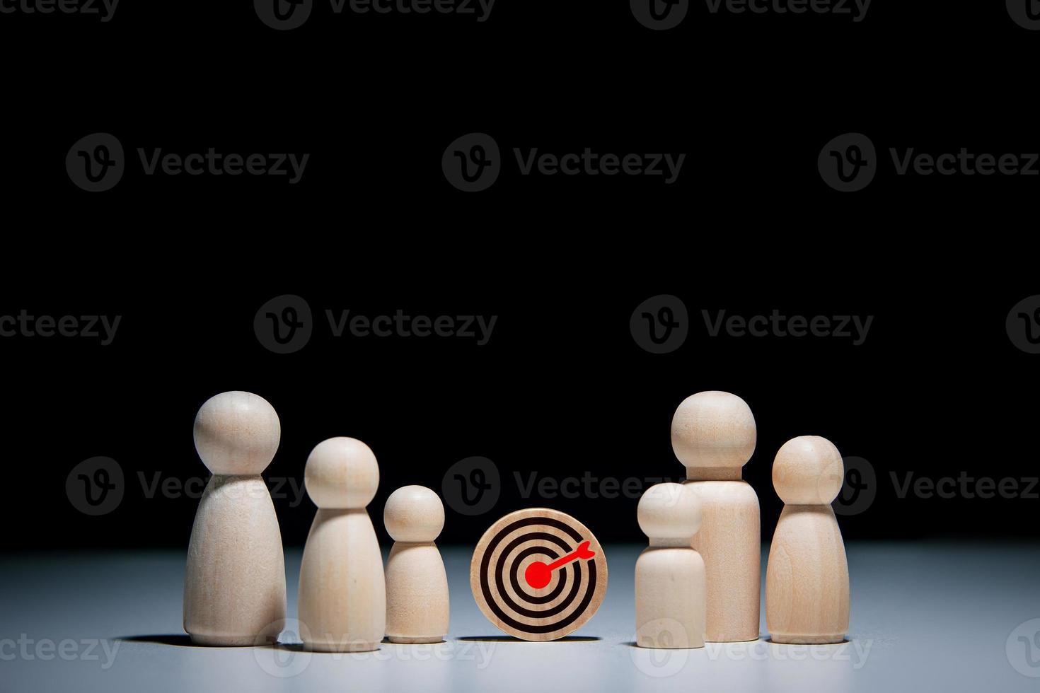 concept of business achievement objective target, teamwork for success. target board icon and wooden doll icon with copy space for business design photo
