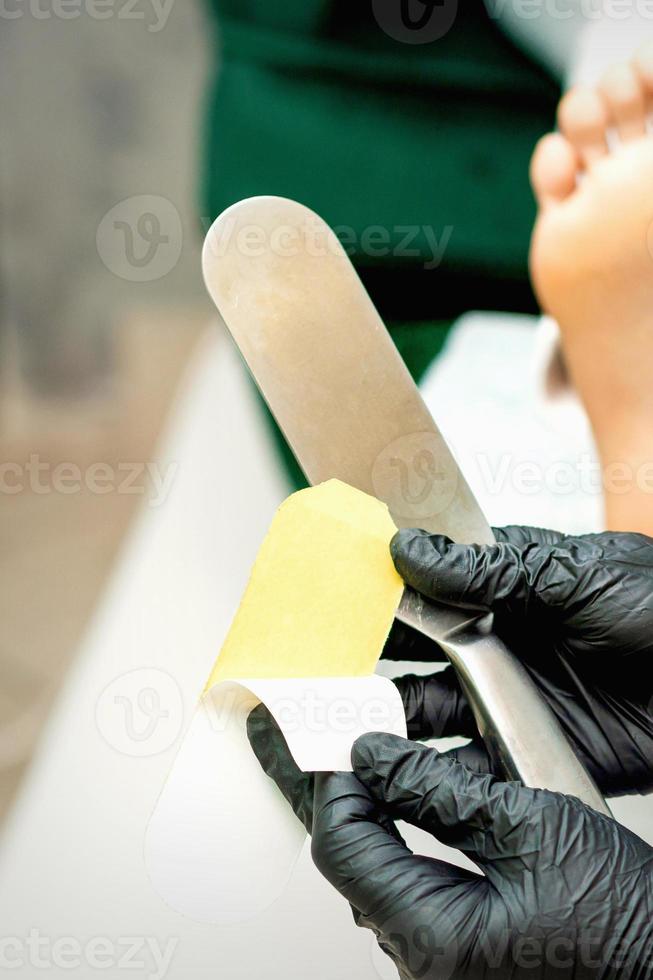 Pedicurist put on new heel file photo