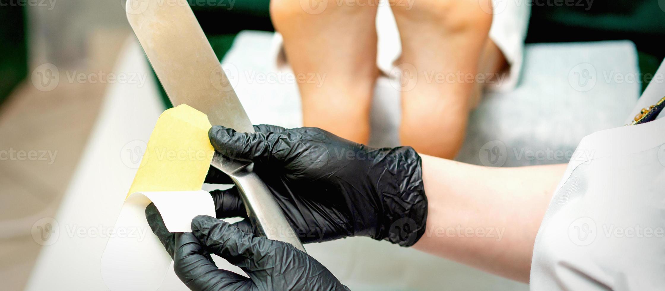 Pedicurist put on new heel file photo