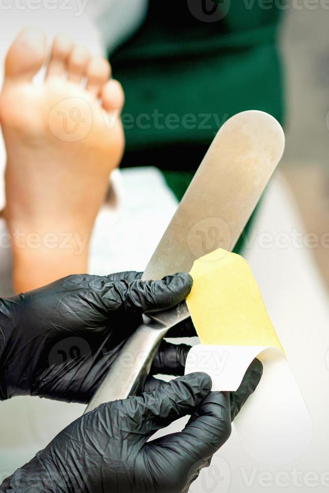 Pedicurist put on new heel file photo