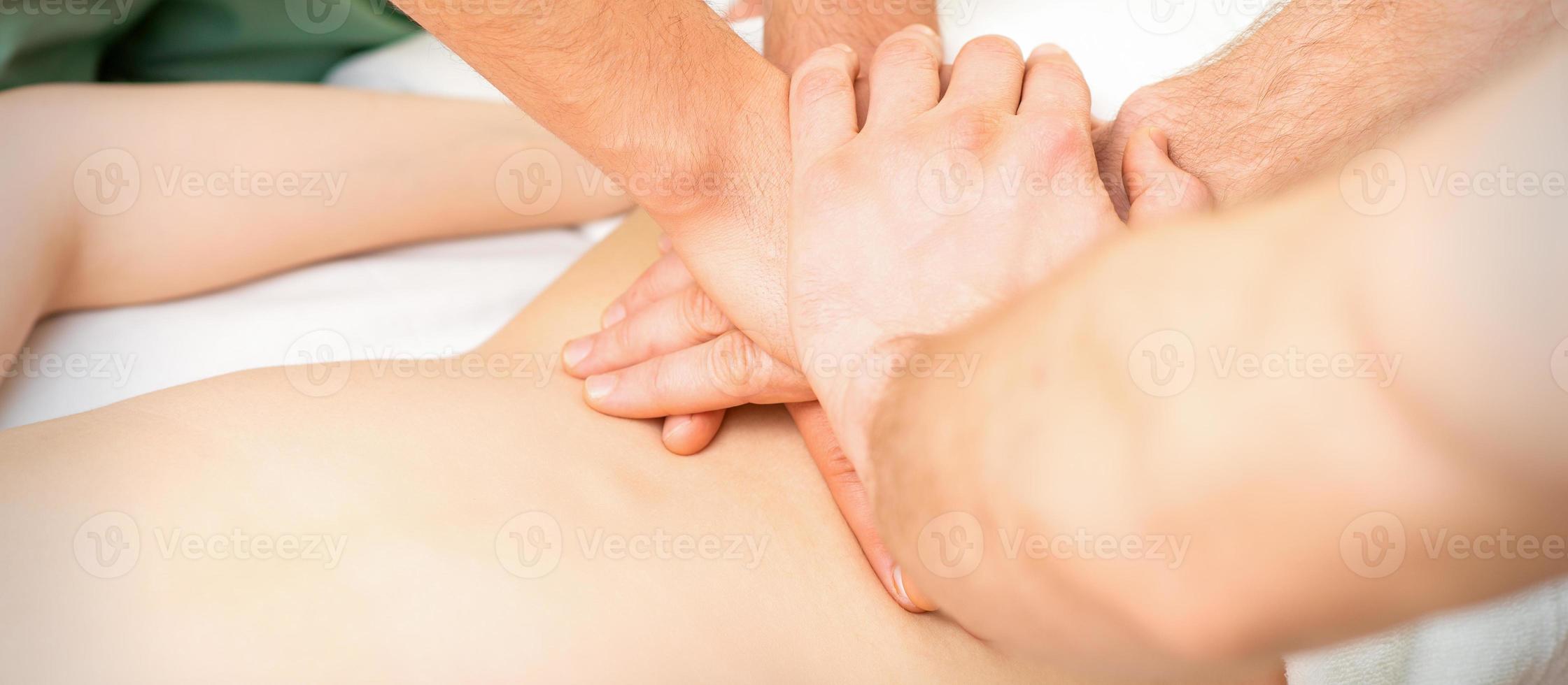 Woman receiving a back massage photo