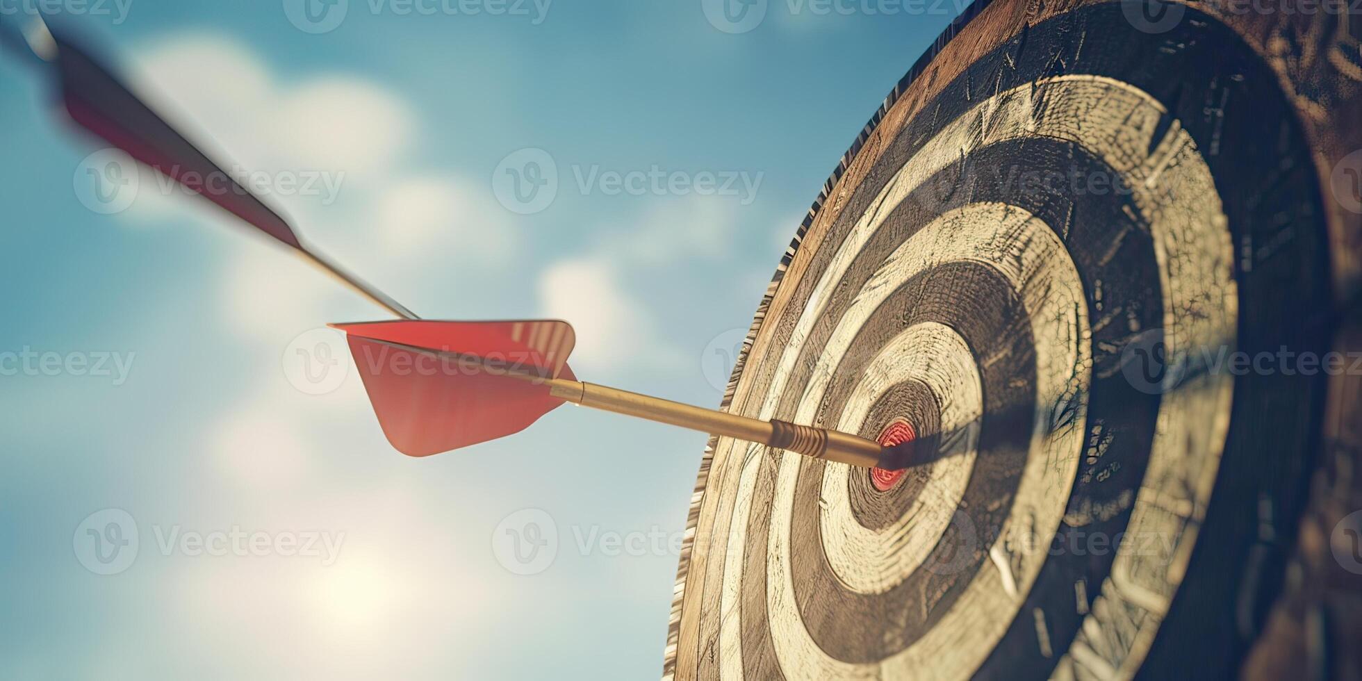 high success concept A red dart arrow aims at the target in the center of the dartboard. Target hit in the middle. . photo