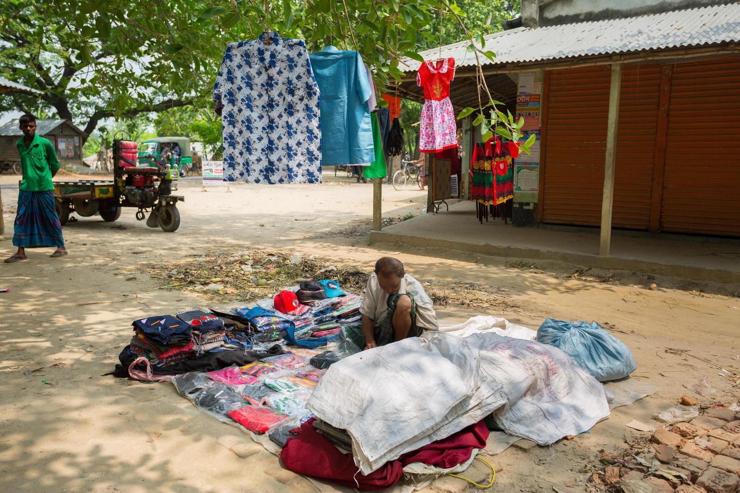 Bangladesh May 19, 2019 A Rural village Businessman selling cloth and products to hang up on the tree trunk, Meherpur, Bangladesh. photo
