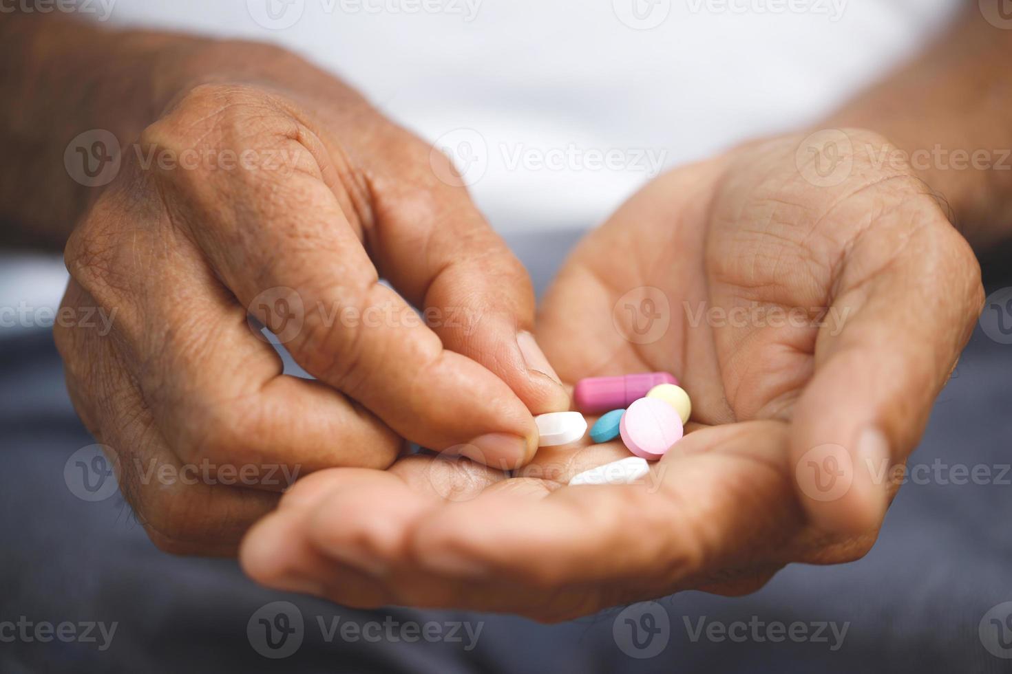 Elderly take painkillers to treat disease. 22679316 Stock Photo at Vecteezy