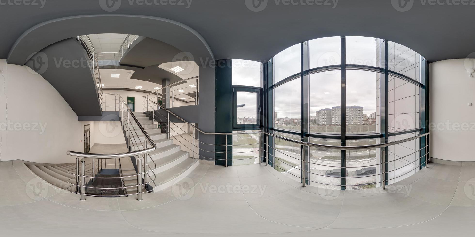 full seamless spherical hdri 360 panorama view in empty modern hall near panoramic windows with columns, staircase and doors in equirectangular projection, ready for AR VR content photo