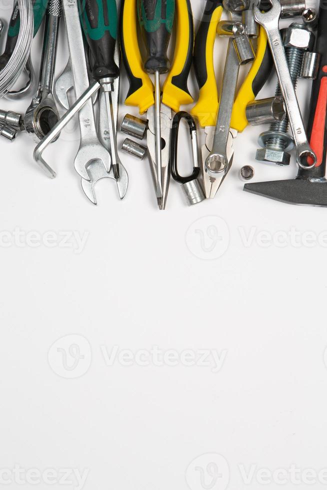 Set of tools for repair in a case on a white background. Assorted work or construction tools. Wrenches, Pliers, screwdriver. Top view photo