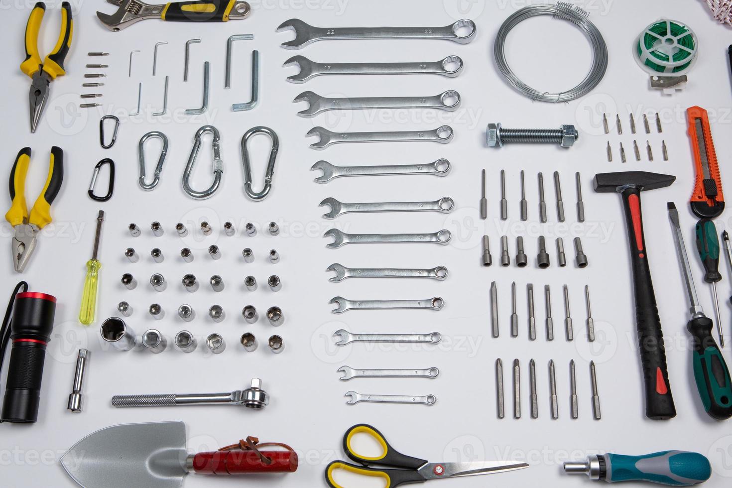 Set of tools for repair in a case on a white background. Assorted work or construction tools. Wrenches, Pliers, screwdriver. Top view photo