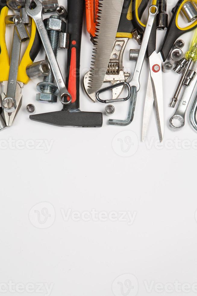 Set of tools for repair in a case on a white background. Assorted work or construction tools. Wrenches, Pliers, screwdriver. Top view photo