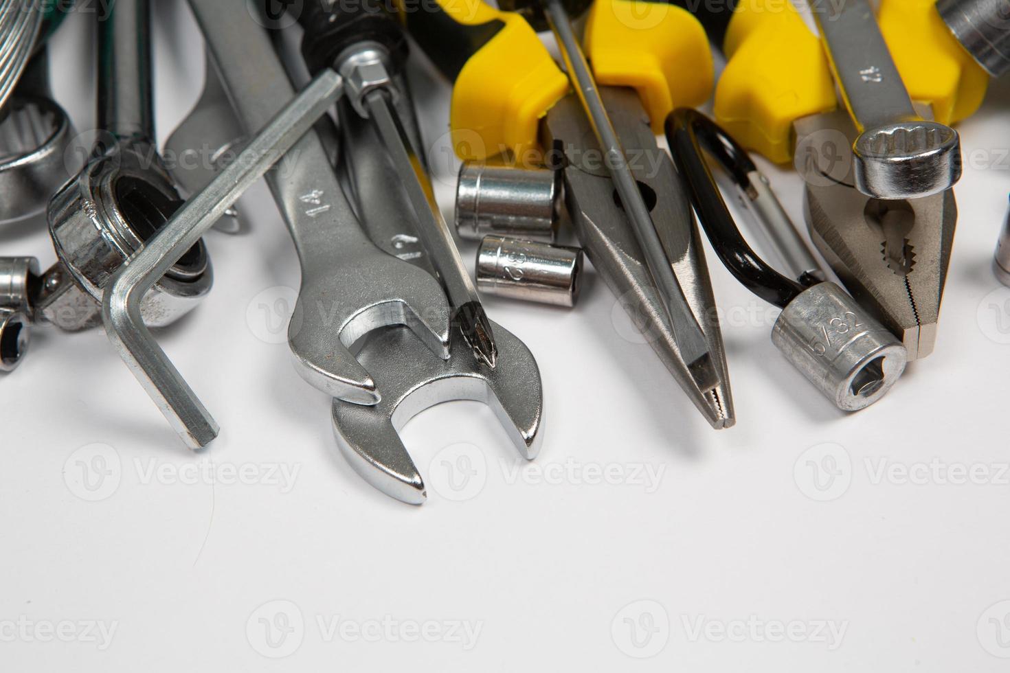 Set of tools for repair in a case on a white background. Assorted work or construction tools. Wrenches, Pliers, screwdriver. Top view photo