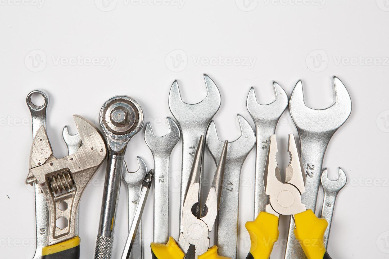 Set of tools for repair in a case on a white background. Assorted work or construction tools. Wrenches, Pliers, screwdriver. Top view photo