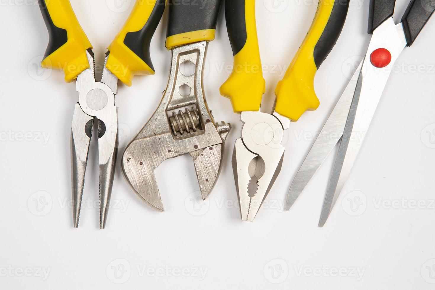 Set of tools for repair in a case on a white background. Assorted work or construction tools. Wrenches, Pliers, screwdriver. Top view photo