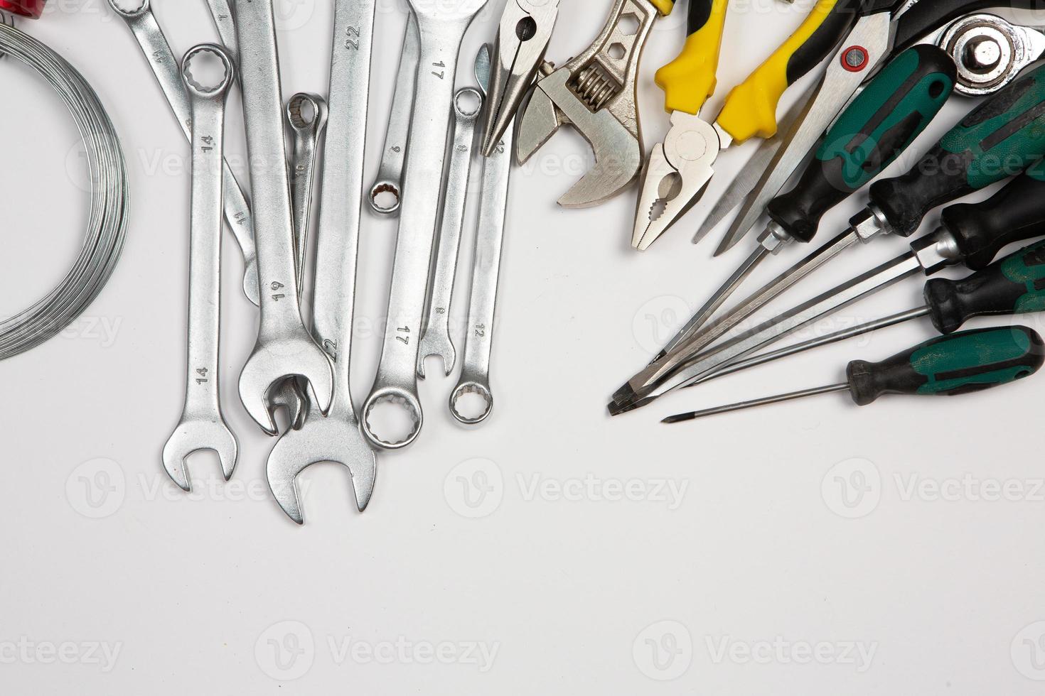 Set of tools for repair in a case on a white background. Assorted work or construction tools. Wrenches, Pliers, screwdriver. Top view photo