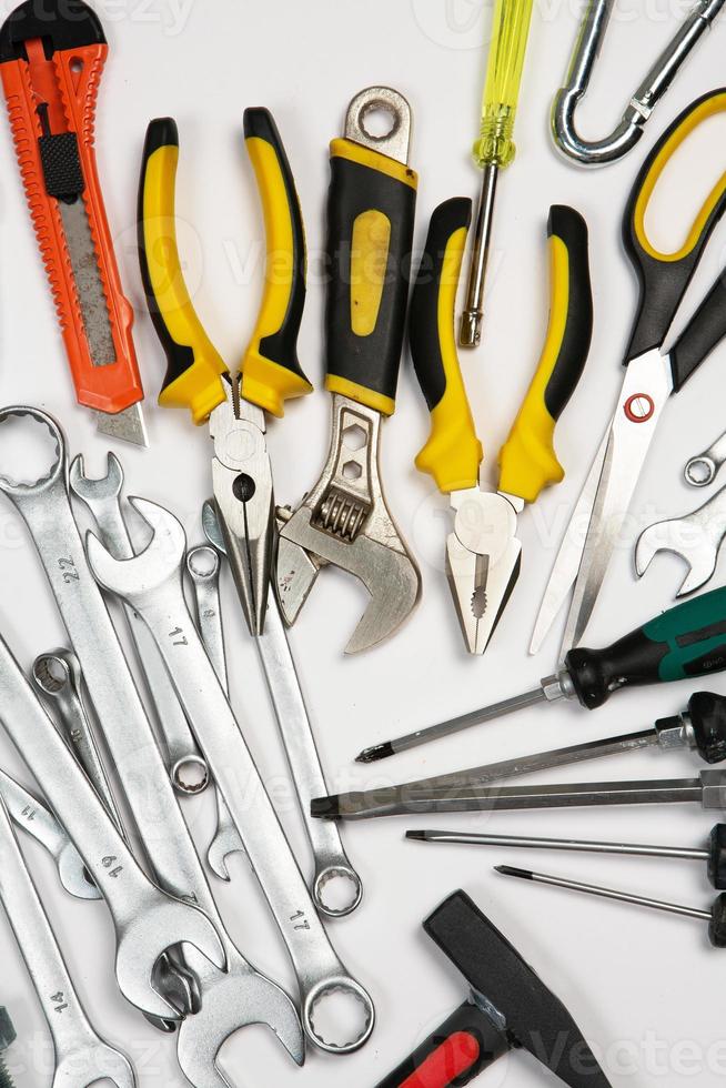 Set of tools for repair in a case on a white background. Assorted work or construction tools. Wrenches, Pliers, screwdriver. Top view photo