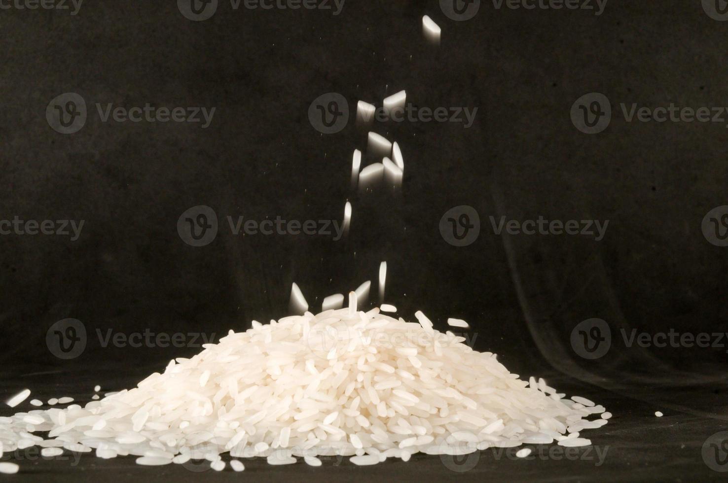White rice on black background photo
