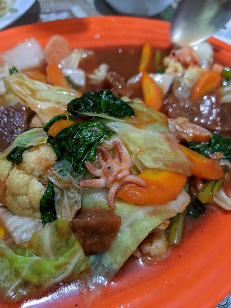 Capcay traditional chinesse food with full vegetables and chicken sausage. The photo is suitable to use for traditional food background, poster and food content media.