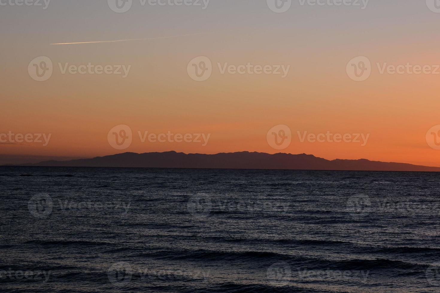 Sunset over the sea photo