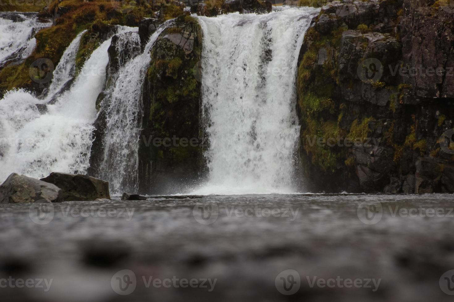 Fantastic view on Kirkjufellsfoss waterfall near Kirkjufell mountain photo