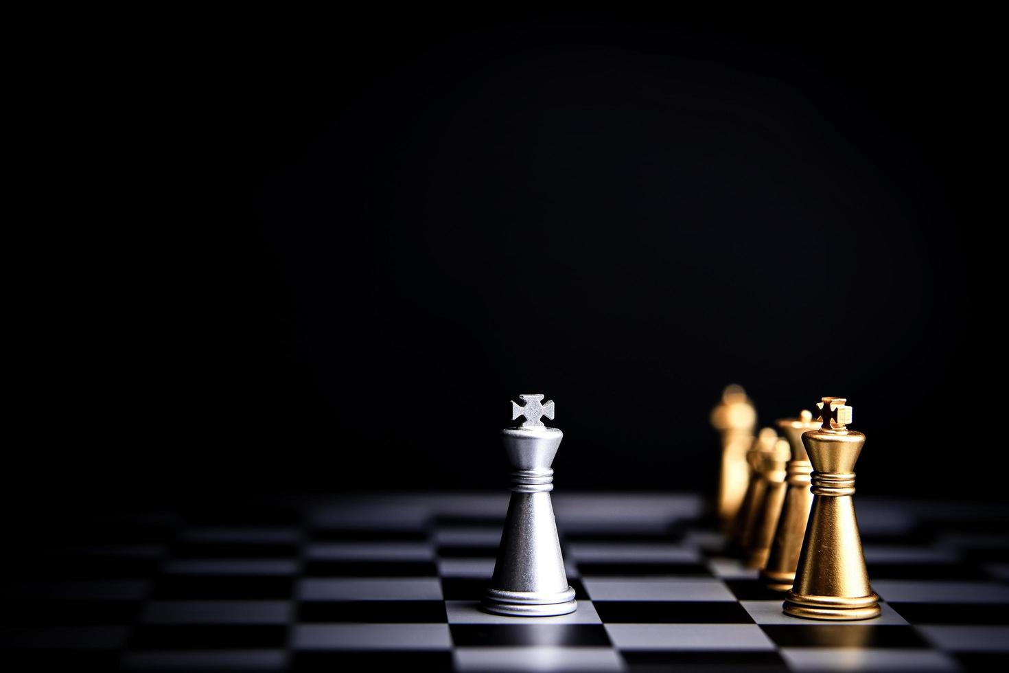 Strategic planning and leadership. Chess game on black and white background. Concept of business showing leadership, decision making, brainstorming with copy space for text. photo