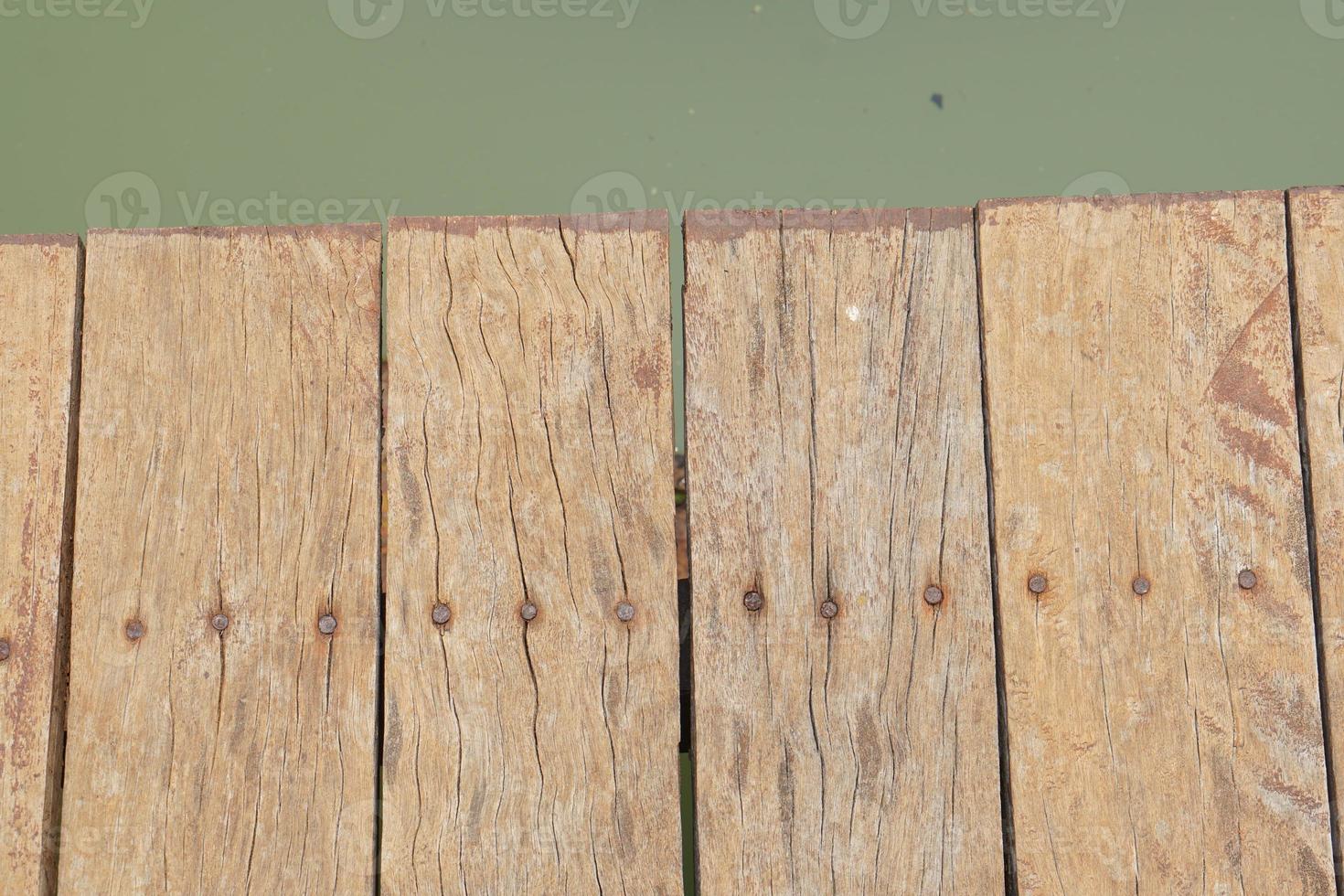 wooden floor walkway in pond photo