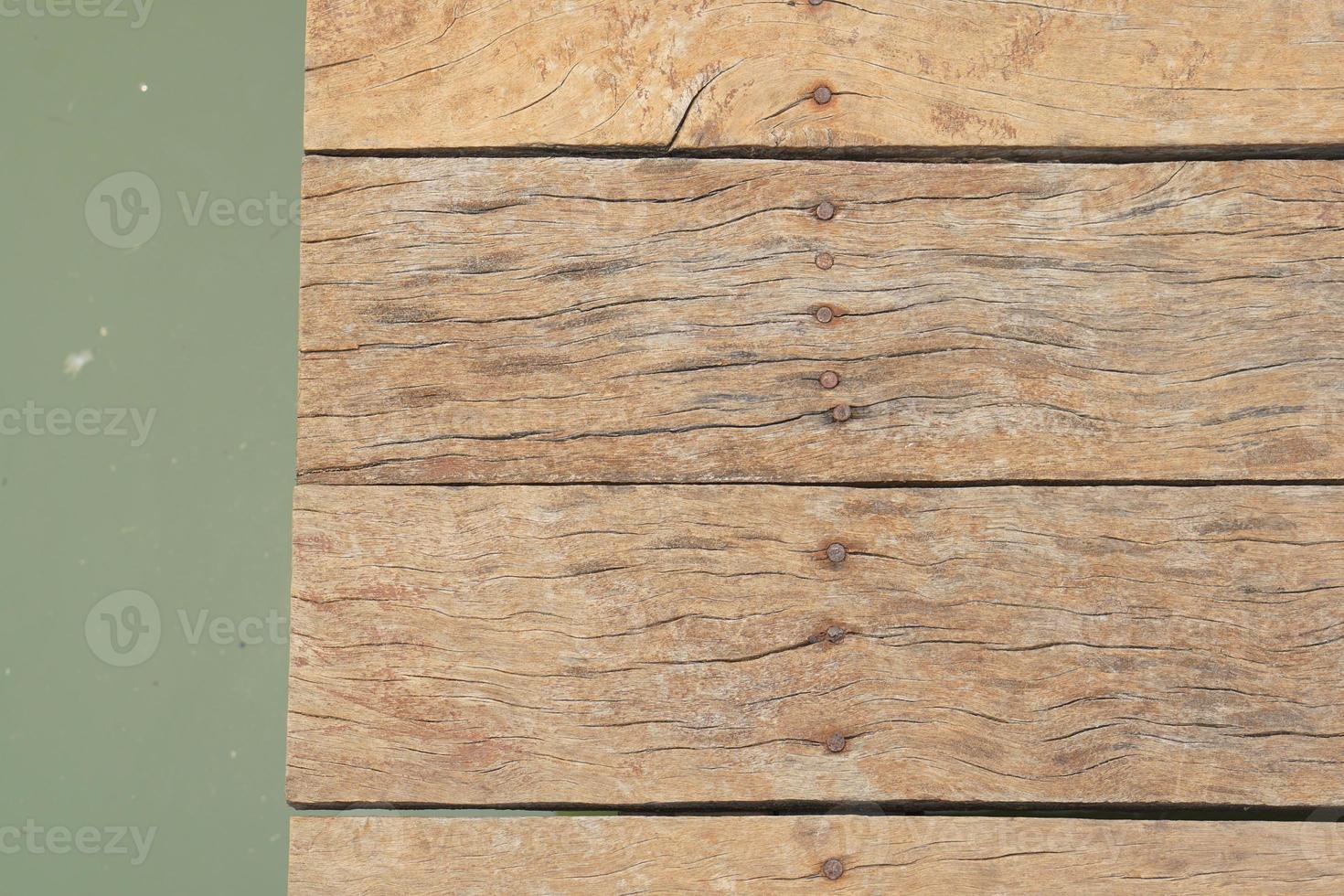 wooden floor walkway in pond photo