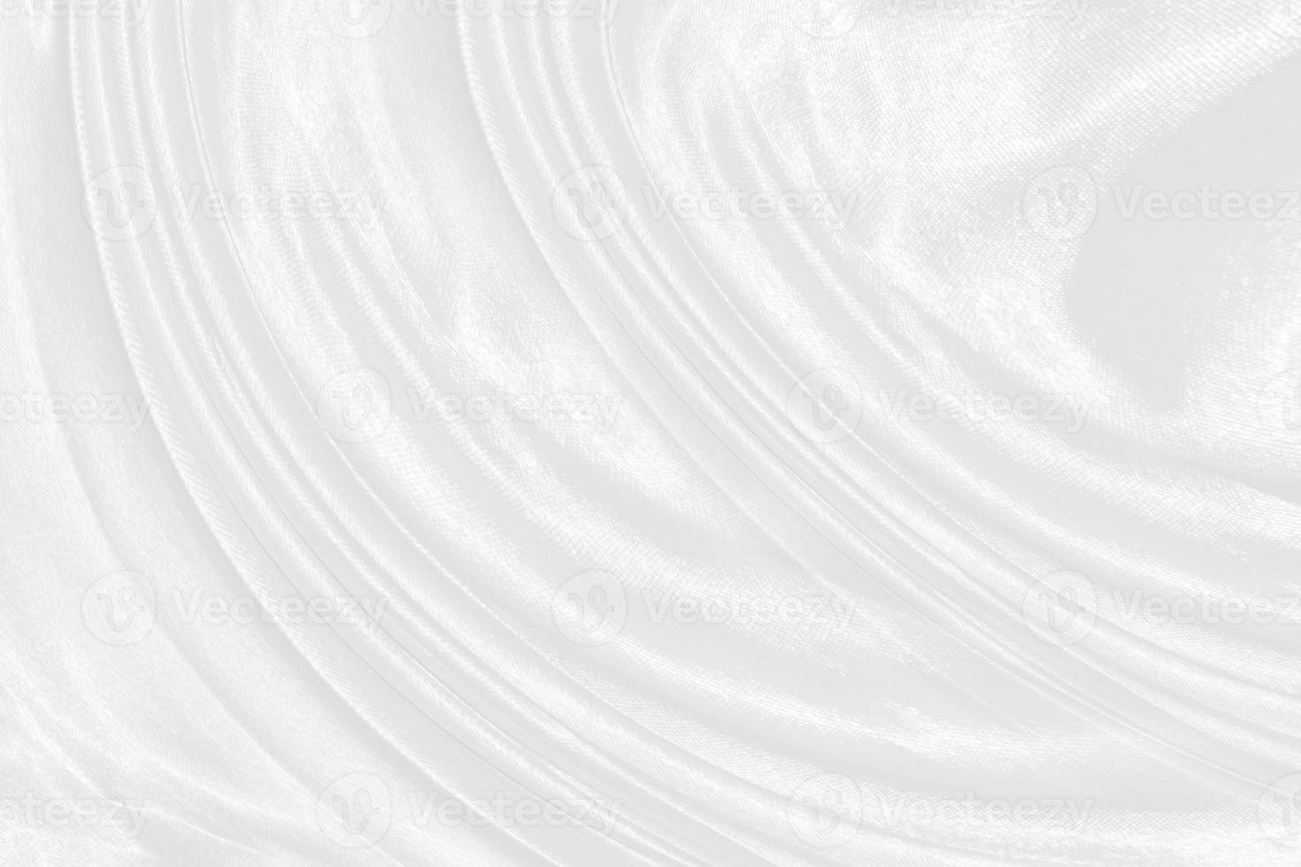 Smooth elegant white silk or satin luxury cloth texture can use as wedding background. Luxurious background design photo